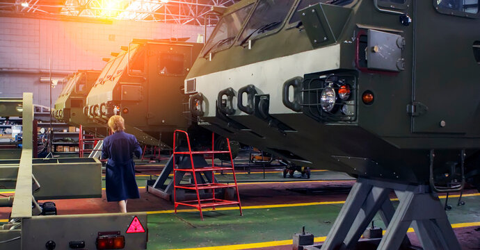 Military equipment assembly at Wheel Tractor Plant during daylight hours