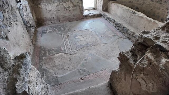 Partially preserved roman mosaic depicting marine life decorating the floor of a bath in the Archaeological Complex of Garni, Armenia, showcasing the rich history and cultural heritage of the site