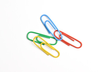 Many colorful paper clips isolated on white background, top view