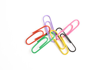 Many colorful paper clips isolated on white background, top view