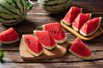 fresh ripe sliced watermelon fruit on wooden table.