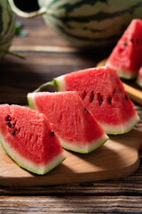 fresh ripe sliced watermelon fruit on wooden table.