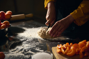 Woman Preparing Dough for Baking Near Fresh Apricots and Ingredients