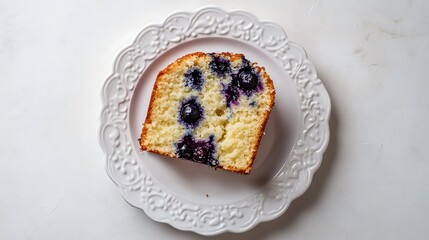 Slice of Blueberry Cake on an Ornate White Plate