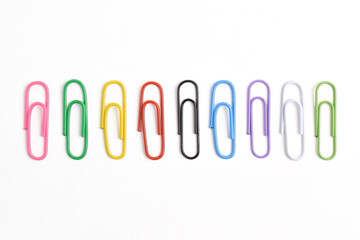 Set with colorful paper clips isolated on white background, top view