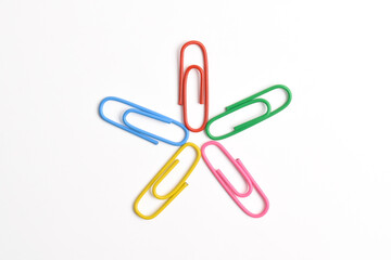 Paper clips isolated on white background, teamwork and success concept.