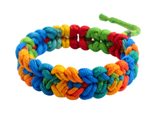 Colorful braided paracord bracelet, isolated on white, a stylish accessory and survival tool for outdoor enthusiasts.