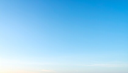 Fototapeta premium A serene and calm abstract blue background with subtle gradient transitions and soft, dreamy texture, reminiscent of a clear summer sky at dusk.
