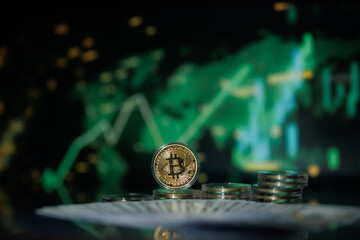 Bitcoin coin with “B” symbol, digital background, and candlestick charts — symbolizing cryptocurrency and virtual income.