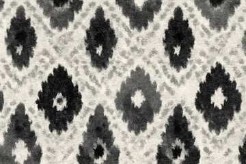 Faded black and white ikat pattern background with geometric diamond shapes, textured fabric surface, traditional textile design, artistic and vintage style