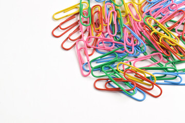 Colorful paper clips isolated on white background. Copy space. Copy space for your text and information