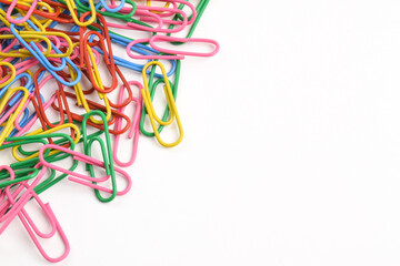 Colorful paper clips isolated on white background. Copy space. Copy space for your text and information