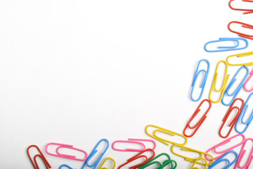 Colorful paper clips isolated on white background. Copy space. Copy space for your text and information