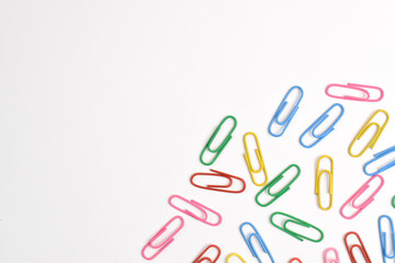 Colorful paper clips isolated on white background. Copy space. Copy space for your text and information