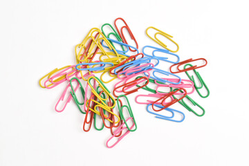 Pile of colorful paper clips isolated on white background
