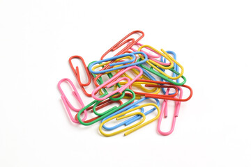 Pile of colorful paper clips isolated on white background