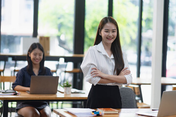 portrait of a young female student in a classroom.