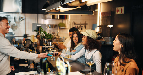 Happy woman, customer and bartender with phone on pos machine for payment or transaction in bar....