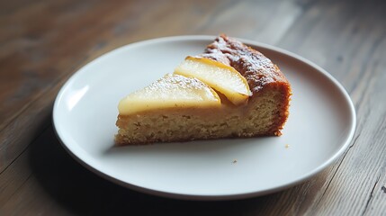 Slice of Pear Cake on a White Plate
