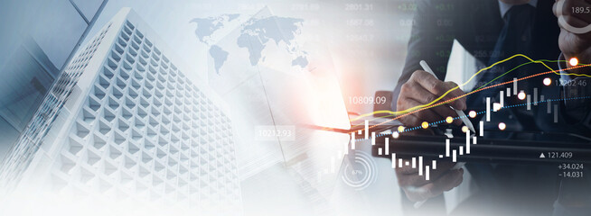 Business, finance and investment concept. Finance analyst using digital tablet analyzing and...