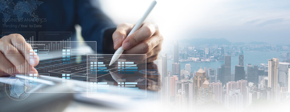 Finance analyst using digital tablet analyzing sales data and financial growth graph chart report, online marketing plan. Business strategy and development. Market research, data analysis