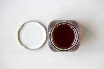 Pure Sundarban Forest honey in an open jar, showcasing its natural sweetness. A 100% pure, top-view shot, perfect as a natural sweetener or food accompaniment.