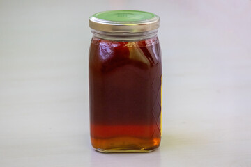 Pure Sundarban Forest Honey in a closed jar, a natural golden sweetener. 100% authentic and delicious, perfect for standalone consumption or with various foods.