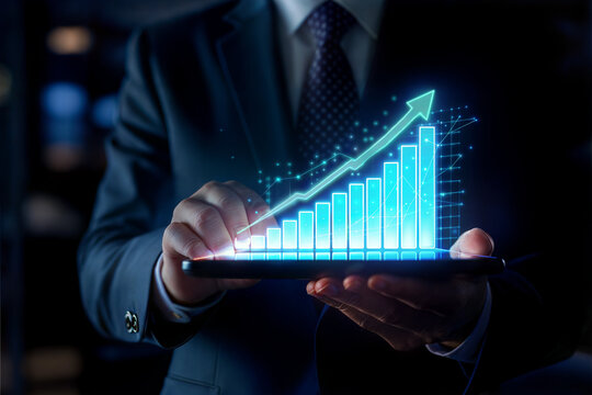 Businessman analyzing upward trend on tablet