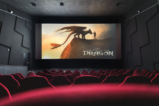 How to Train Your Dragon movie playing in empty cinema, fantasy animation on big screen.