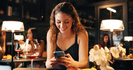 Happy, woman and phone with texting in restaurant for online dating app, dinner planning and chat....