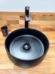 Modern Black Vessel Sink with Matte Finish and Minimalist Faucet on Wooden Countertop