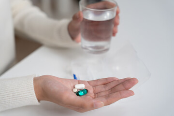 girl holding medicine and take medicine, pain, cure disease, sterilize, take vitamin, sedative, health care, Dietary supplement, medicine for medical treatment, tonic, daily dosage of medication