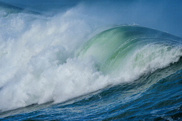 Powerful ocean waves crash along the Hermanus shoreline after a dramatic winter storm, capturing...