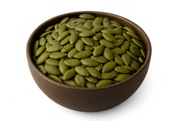 Ceramic bowl filled with raw, hulled pumpkin seeds, nutritious and appetizing, sitting against transparent surface