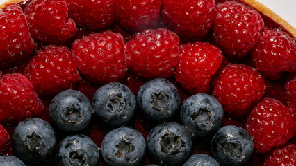 An exquisite tapestry of blueberries and raspberries, a festive nod to Lammas and magical berry-laden Midsummer feasts