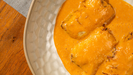 Golden-hued paneer tikka submerged in velvety masala, evoking Diwali feasts and culinary artistry,...