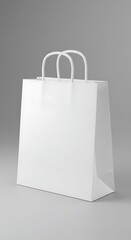 A plain white paper shopping bag with rope handles stands upright against a light gray background.