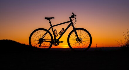 Obraz premium Bicycle Silhouette at Sunset with Colorful Sky Outdoor Cycling