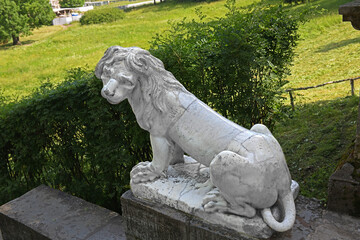 White marble lion at top of Big Stone Staircase in Pavlovsk park, suburb of Saint Petersburg, Russia