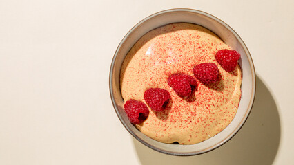 Creamy raspberry mousse caressed by vibrant topping, a whimsical dessert dance for Syttende Mai...