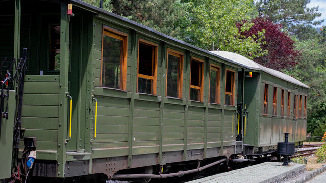 Vintage green train car whispers tales of bygone journeys, evoking nostalgia on Railway Heritage Day, perfect for steampunk adventures  &Scaron;arganska (sharganska) osmica