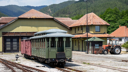Vintage railway carriage rests at rustic station, whispering stories of bygone wanderlust, perfect for Nostalgia Day or Train Lovers' Festival  Šarganska (sharganska) osmica