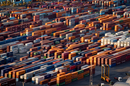 Barcelona, Spain - 18th July 2025: Shipping containers and cargo ships are seen in the port. Concept of trade war and maritime trade and tariffs