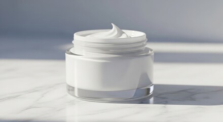 White cream in a clear jar with a blank label