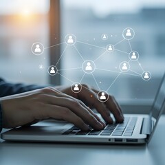 Hands typing on laptop with digital network connections