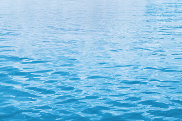 Fototapeta premium Blue reflective ocean or sea water. Background.