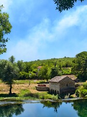 Stone House by a Tranquil Lake in a Scenic Countryside Area