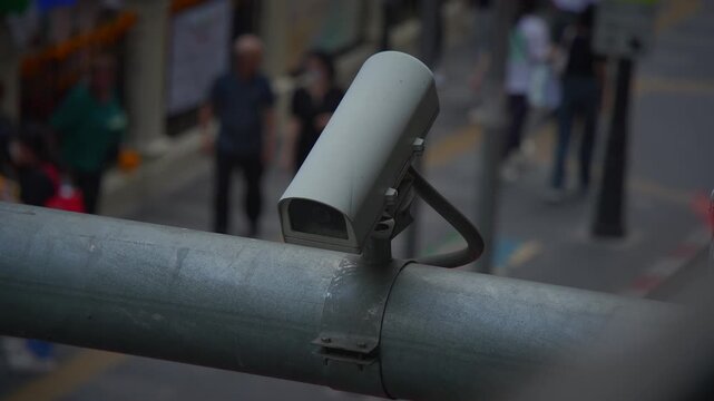 Urban surveillance cameras monitor the bustling life of streets in a busy city environment