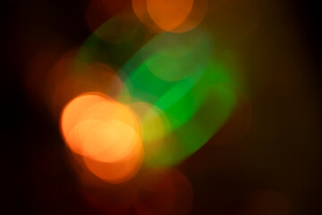 light leak overlay effect with bokeh green and orange light leaks,retro noisy film texture light leak flare on black background,abstract colorful background