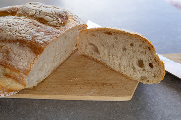 Sliced sourdough bread on cutting board
